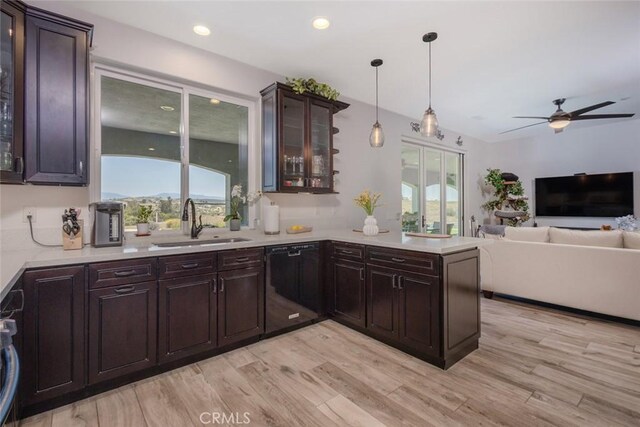 38550 Crossover Rd, Temecula, CA 92592 - kitchen featuring black dishwasher, light countertops, a sink, ceiling fan, and plenty of natural light