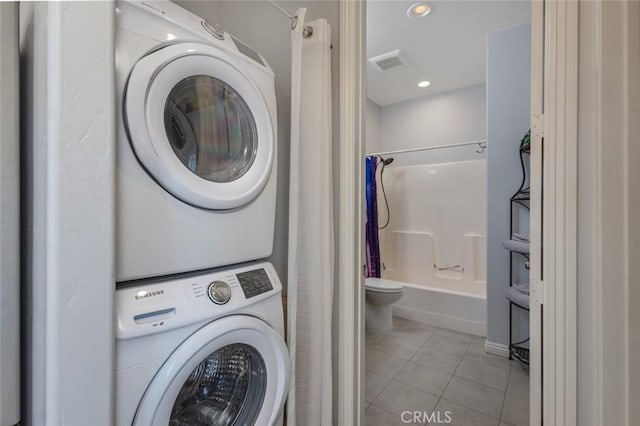 38550 Crossover Rd, Temecula, CA 92592 - laundry area with estacked washer and dryer, light tile patterned flooring, and recessed lighting