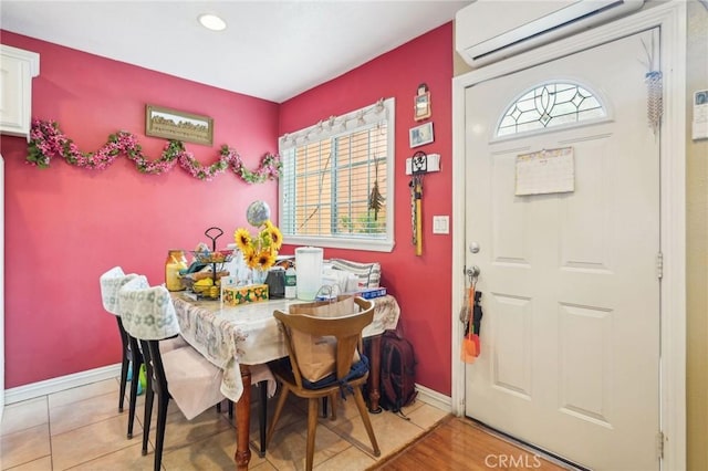 dining room with a wall mounted AC, plenty of natural light, baseboards, and recessed lighting