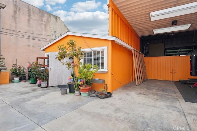 view of side of home featuring stucco siding