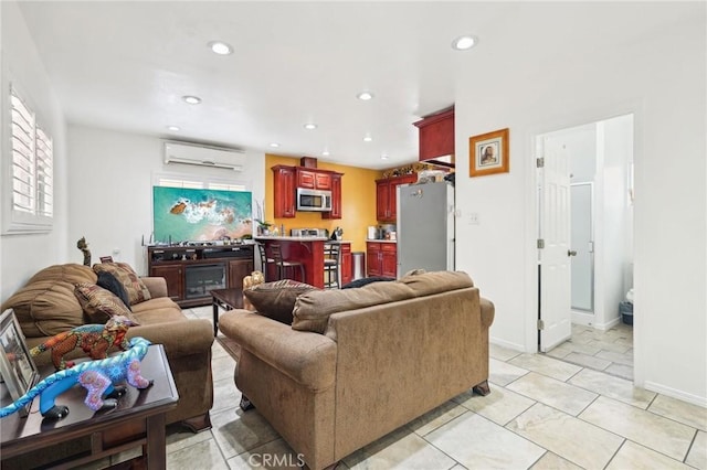 living area featuring recessed lighting, an AC wall unit, and baseboards