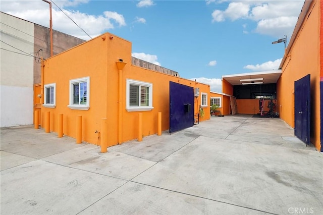 view of property exterior with stucco siding