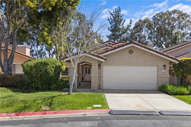 744 Clearview Ln, San Luis Obispo, CA 93405 - view of front facade with stucco siding, driveway, a garage, a front yard, and a tile roof