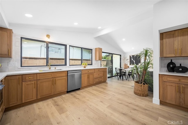 16009 Jalon Rd, La Mirada, CA 90638 - kitchen featuring dishwasher, a sink, tasteful backsplash, brown cabinets, and light wood finished floors
