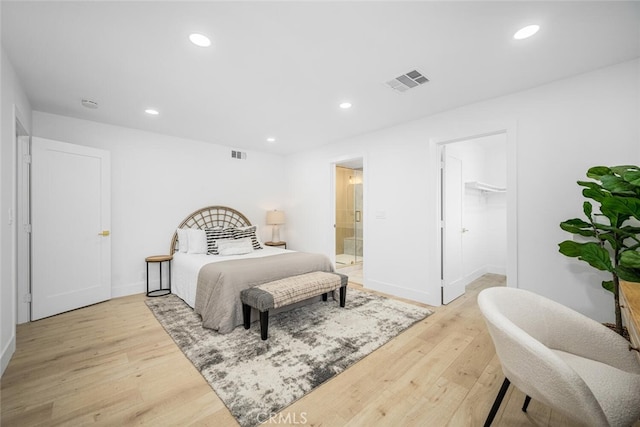 16009 Jalon Rd, La Mirada, CA 90638 - bedroom with light wood-style flooring, recessed lighting, baseboards, ensuite bathroom, and a spacious closet