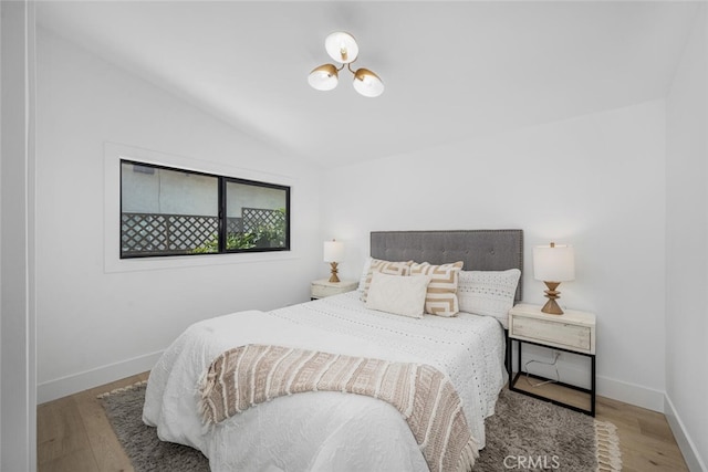 16009 Jalon Rd, La Mirada, CA 90638 - bedroom featuring vaulted ceiling, wood finished floors, and baseboards