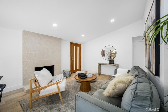16009 Jalon Rd, La Mirada, CA 90638 - living room with recessed lighting, wood finished floors, baseboards, and a tiled fireplace
