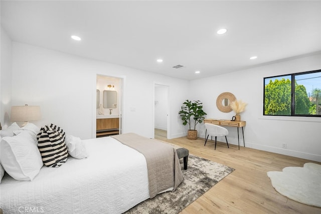 16009 Jalon Rd, La Mirada, CA 90638 - bedroom featuring wood finished floors, recessed lighting, baseboards, ensuite bathroom, and a spacious closet
