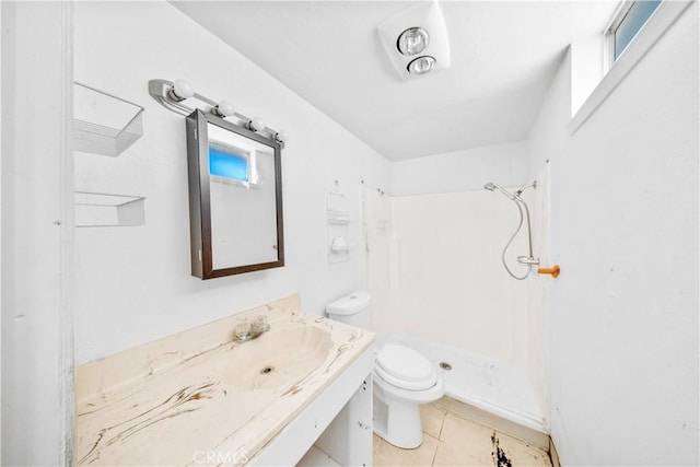 bathroom featuring toilet, a shower stall, tile patterned floors, and vanity