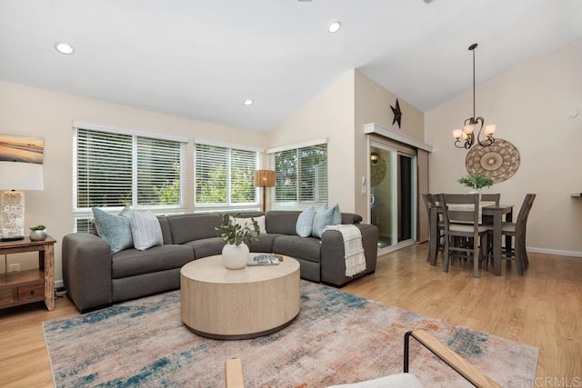 1715 Kennington Rd, Encinitas, CA 92024 - living area with vaulted ceiling, a chandelier, wood finished floors, recessed lighting, and baseboards