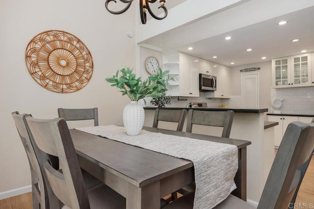 1715 Kennington Rd, Encinitas, CA 92024 - dining area featuring light wood-style flooring, recessed lighting, a chandelier, and baseboards