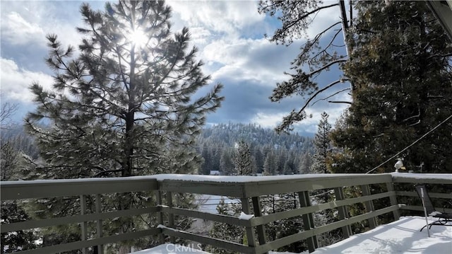383 Golf Course Rd, Lake Arrowhead, CA 92352 - snow covered deck with a wooded view