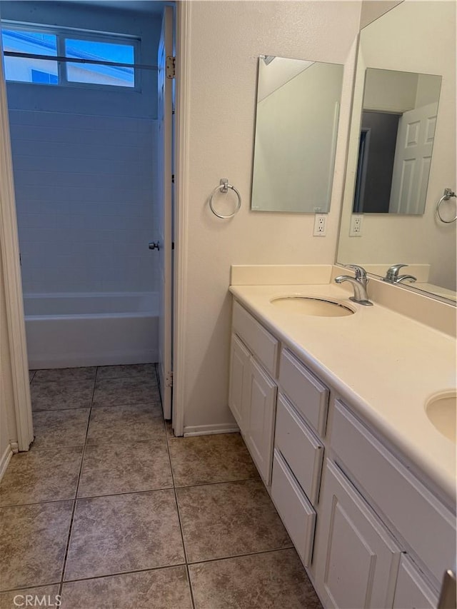 11946 Russell Ct, Victorville, CA 92392 - full bathroom with double vanity, baseboards, tile patterned flooring, and bathing tub / shower combination