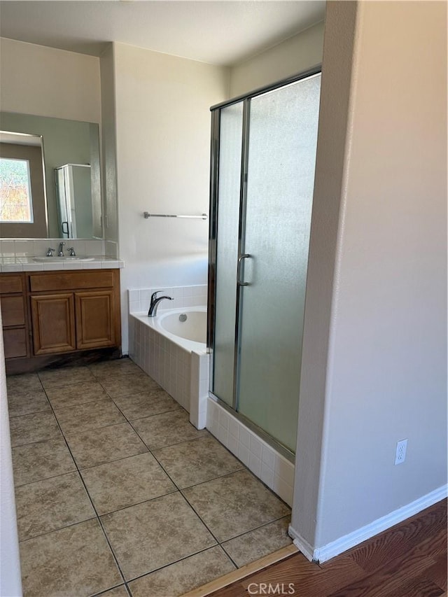 11946 Russell Ct, Victorville, CA 92392 - bathroom featuring a shower stall, vanity, a garden tub, and tile patterned flooring