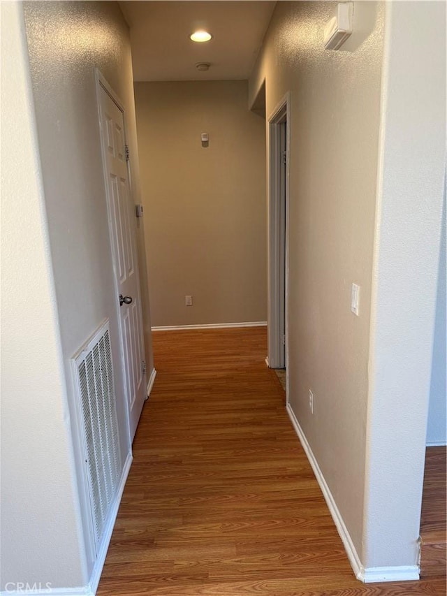 11946 Russell Ct, Victorville, CA 92392 - hallway featuring wood finished floors, baseboards, and recessed lighting