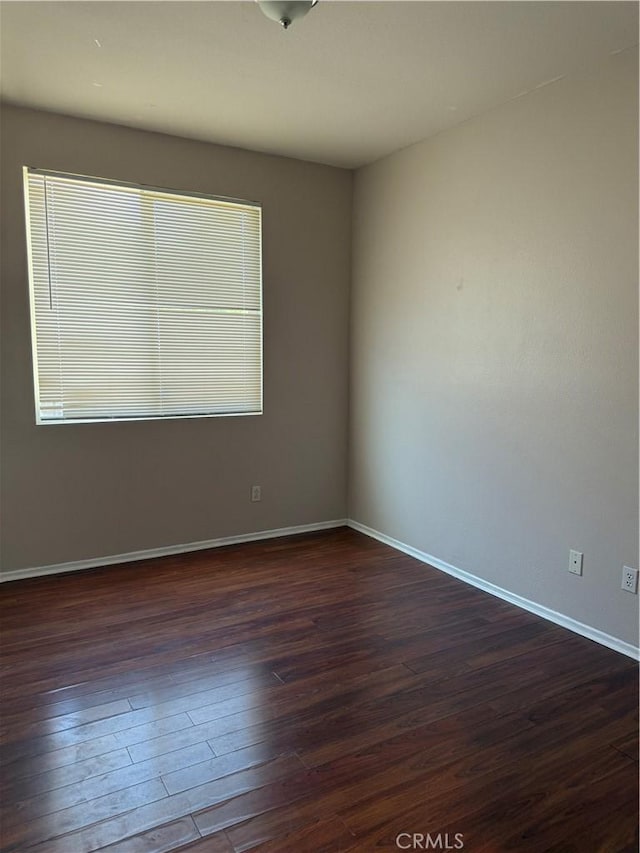 11946 Russell Ct, Victorville, CA 92392 - empty room with dark wood-style floors and baseboards