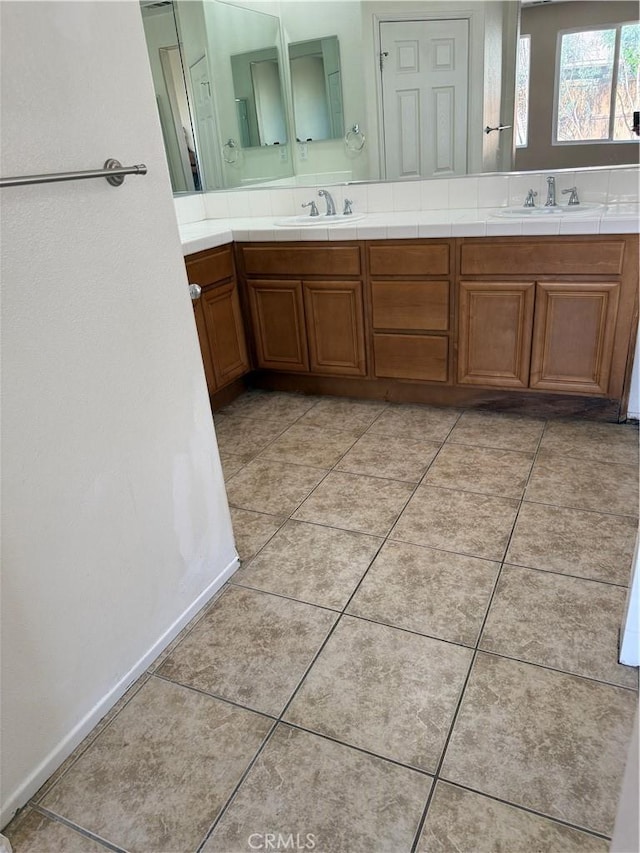 11946 Russell Ct, Victorville, CA 92392 - bathroom featuring double vanity and tile patterned flooring
