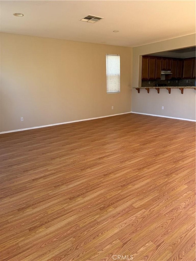 11946 Russell Ct, Victorville, CA 92392 - spare room featuring light wood-style flooring and baseboards