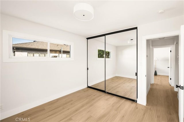 6340 Charlwood St, Lakewood, CA 90713 - unfurnished bedroom featuring light wood-style floors, baseboards, and a closet