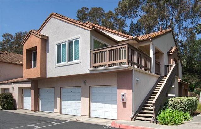 28071 Caldaro, Laguna Niguel, CA 92677 - view of front facade featuring a garage, a balcony, and stucco siding
