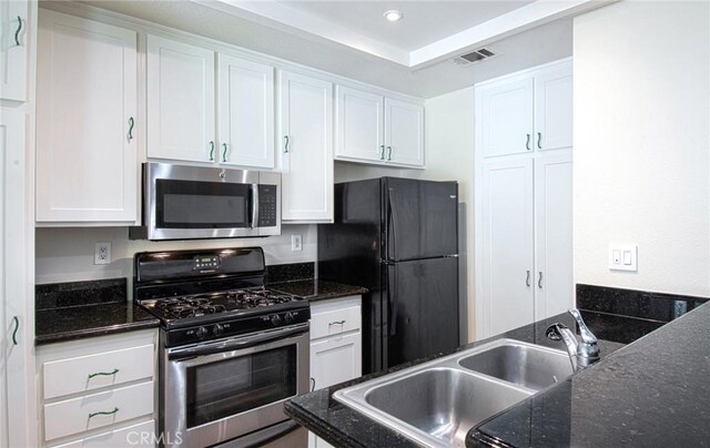 28071 Caldaro, Laguna Niguel, CA 92677 - kitchen featuring stainless steel appliances, a sink, white cabinetry, recessed lighting, and dark stone counters