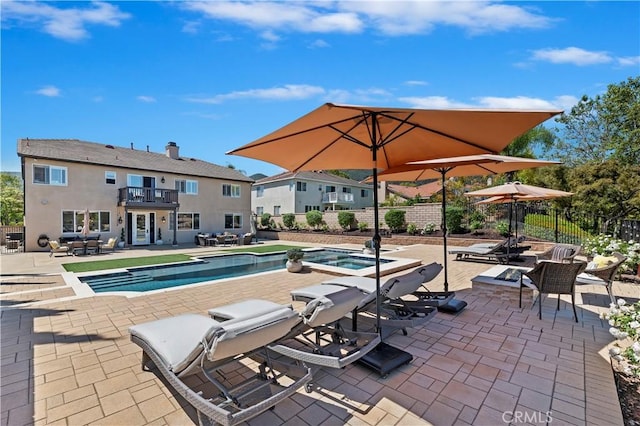 1663 Spyglass Dr, Corona, CA 92883 - view of pool with a patio, fence, outdoor dining area, and a pool with connected hot tub