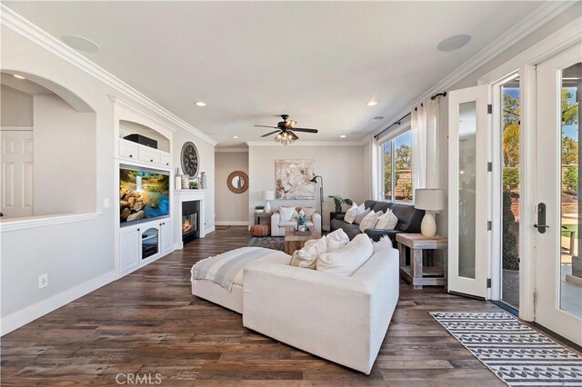 1663 Spyglass Dr, Corona, CA 92883 - living room with recessed lighting, dark wood finished floors, ornamental molding, a ceiling fan, and a glass covered fireplace