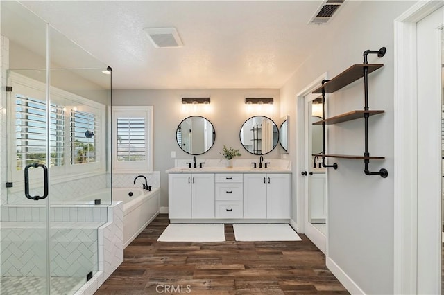 1663 Spyglass Dr, Corona, CA 92883 - full bath featuring wood finished floors, a stall shower, a garden tub, and double vanity