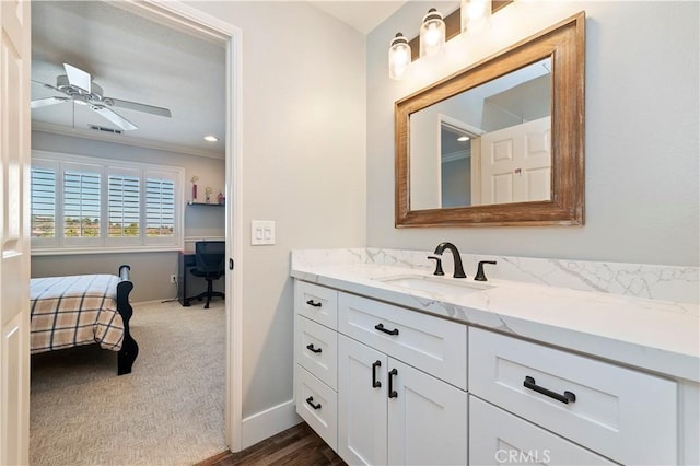 1663 Spyglass Dr, Corona, CA 92883 - bathroom with ceiling fan, baseboards, vanity, ornamental molding, and wood finished floors