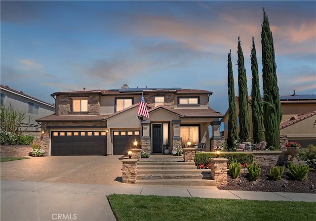 1663 Spyglass Dr, Corona, CA 92883 - view of front of home featuring stucco siding, roof mounted solar panels, driveway, an attached garage, and stone siding