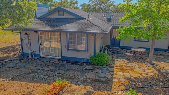 5030 Creek Front Rd, Catheys Valley, CA 95306 - back of house with a chimney, roof with shingles, and a patio