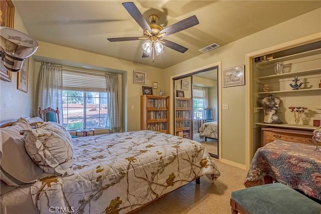 5030 Creek Front Rd, Catheys Valley, CA 95306 - carpeted bedroom with multiple windows, a ceiling fan, and baseboards