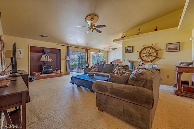 5030 Creek Front Rd, Catheys Valley, CA 95306 - carpeted living room with a wood stove and ceiling fan