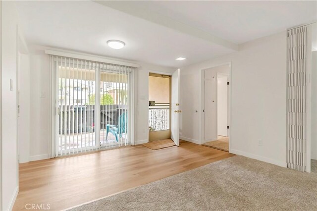 22935 Nadine Cir Unit A, Torrance, CA 90505 - carpeted empty room with baseboards and wood finished floors