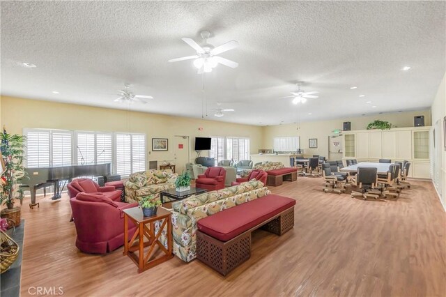 22935 Nadine Cir Unit A, Torrance, CA 90505 - living room featuring a textured ceiling, wood finished floors, recessed lighting, and ceiling fan