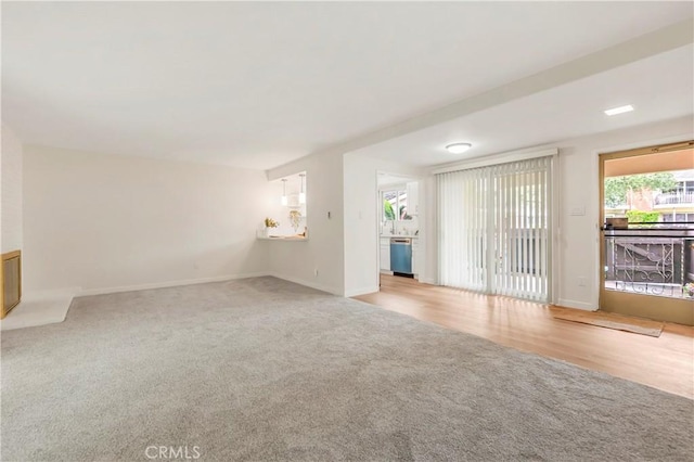 22935 Nadine Cir Unit A, Torrance, CA 90505 - unfurnished living room with carpet flooring and baseboards