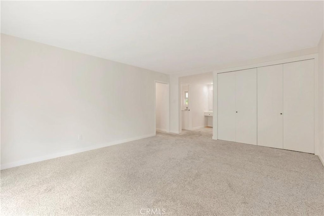 22935 Nadine Cir Unit A, Torrance, CA 90505 - unfurnished bedroom featuring light carpet, baseboards, and a closet