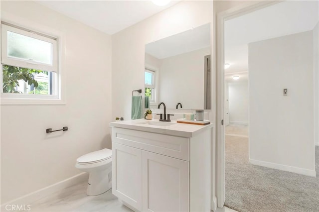 22935 Nadine Cir Unit A, Torrance, CA 90505 - bathroom featuring baseboards, vanity, plenty of natural light, and toilet