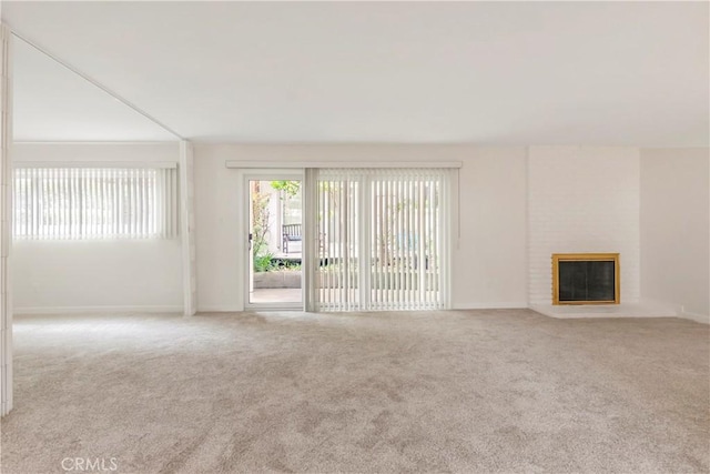 22935 Nadine Cir Unit A, Torrance, CA 90505 - unfurnished living room featuring carpet flooring, baseboards, and a brick fireplace