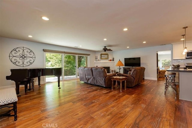 225 Hacienda Ave, San Luis Obispo, CA 93401 - living room with a ceiling fan, a brick fireplace, wood finished floors, recessed lighting, and baseboards
