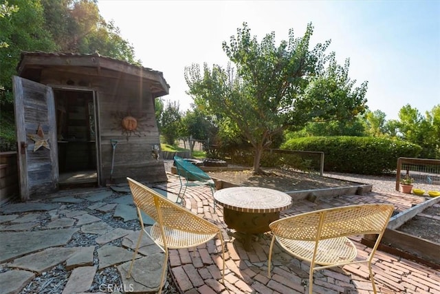 225 Hacienda Ave, San Luis Obispo, CA 93401 - view of patio / terrace with an outbuilding and outdoor dining area