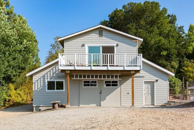 225 Hacienda Ave, San Luis Obispo, CA 93401 - rear view of house with a deck and an attached garage