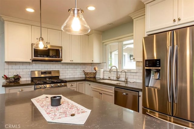 225 Hacienda Ave, San Luis Obispo, CA 93401 - kitchen featuring appliances with stainless steel finishes, a sink, backsplash, hanging light fixtures, and recessed lighting
