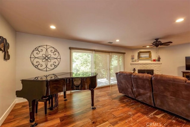225 Hacienda Ave, San Luis Obispo, CA 93401 - living area featuring wood finished floors, recessed lighting, ceiling fan, a lit fireplace, and baseboards