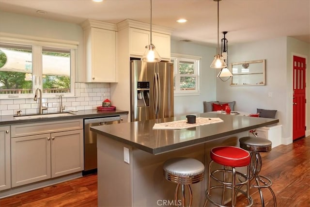 225 Hacienda Ave, San Luis Obispo, CA 93401 - kitchen featuring stainless steel appliances, a sink, dark countertops, dark wood-style flooring, and recessed lighting