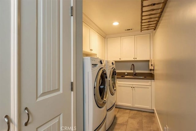225 Hacienda Ave, San Luis Obispo, CA 93401 - laundry area featuring separate washer and dryer, cabinet space, light tile patterned floors, recessed lighting, and baseboards