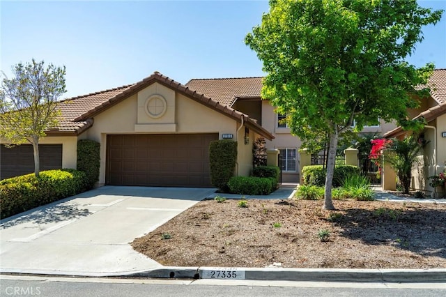 27335 Paseo Laguna, San Juan Capistrano, CA 92675 - view of front of house featuring an attached garage, stucco siding, driveway, and a tiled roof