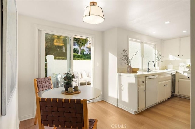 69 Cottonwood Cir, Rolling Hills Estates, CA 90274 - kitchen with light wood-style floors, healthy amount of natural light, a sink, light countertops, and recessed lighting