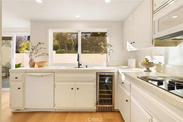 69 Cottonwood Cir, Rolling Hills Estates, CA 90274 - bar with wine cooler, white appliances, a sink, light wood-style flooring, and recessed lighting