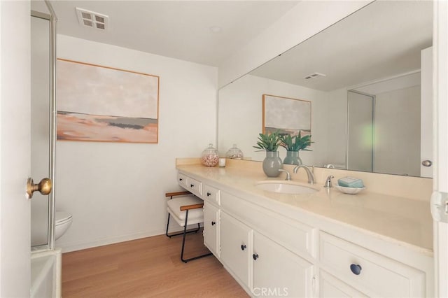 69 Cottonwood Cir, Rolling Hills Estates, CA 90274 - full bath featuring vanity, wood finished floors, toilet, baseboards, and a bathtub